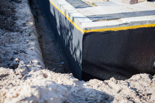 Professional Waterproofing technician working in Severn, MD